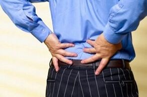 pain in the lower back due to osteochondrosis